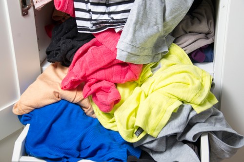 Recycling bins and sorted garden materials ready for transfer